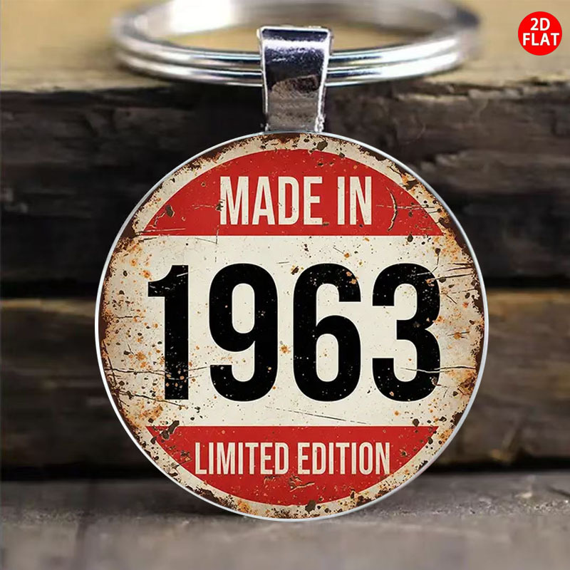 item picture a keychain featuring   with a red and white striped background and the text made in 1963     for   men and women it serves as a decorative piece for bags and car keys making it an ideal gift for christmas anniversaries