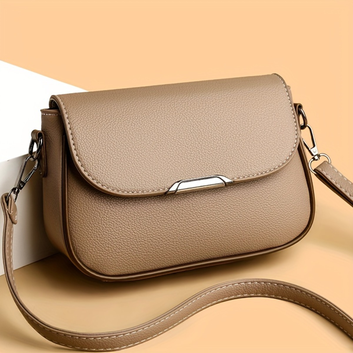 

A Stylish Mini Shoulder Bag For Women, A Compact Square Bag With A Large Flap, An Handbag, And A Spacious Messenger Bag.