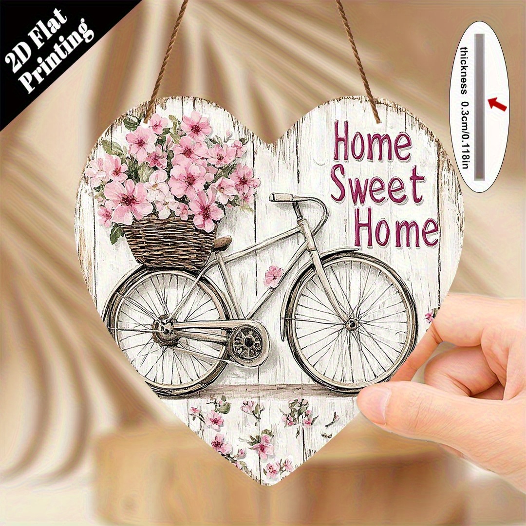E-shop 2D-Flach, 2D-Ebene – Ein 2D-gedrucktes Willkommensschild aus Holz im Vintage-Stil mit herzförmigem Design, Fahrrad- rosa Blumenmustern.
