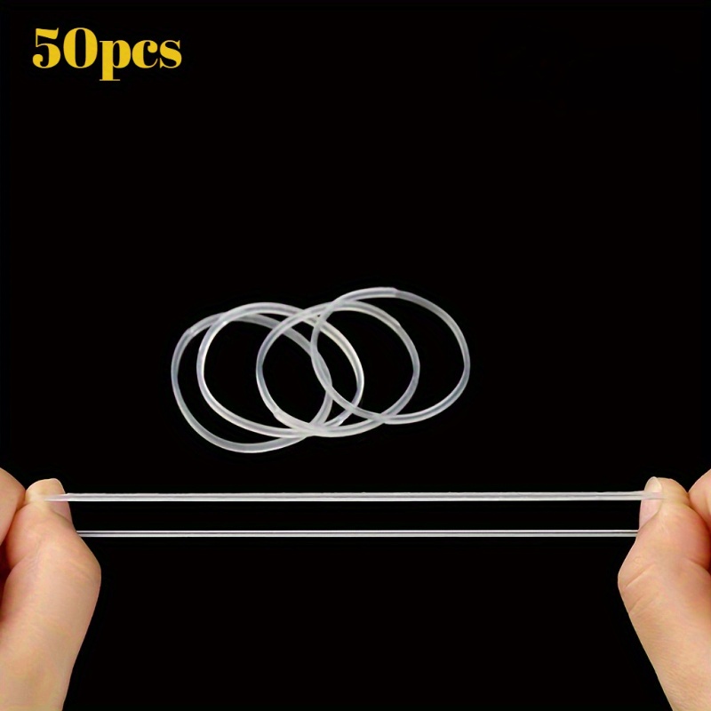 50pcs Of White, Elastic, Transparent Silicone Rings With A Diameter Of 4 Centimeters. Rings Folded And Stretched, Making Them Ideal For Use .