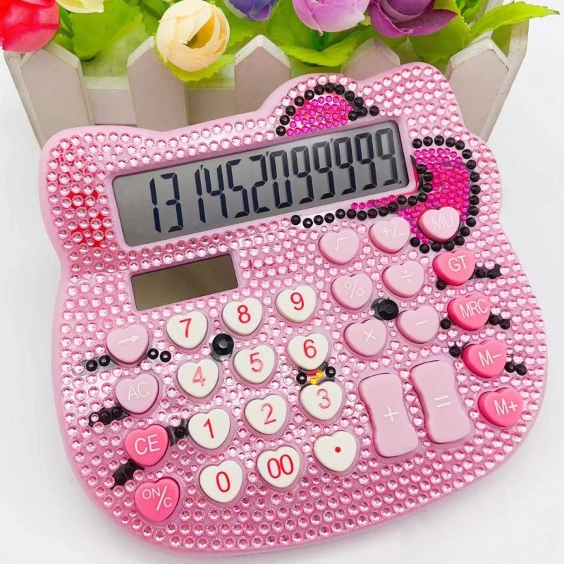   calculator   a   calculator decorated with   with   bow and heart buttons it has a cartoon design and is set with diamonds no battery included