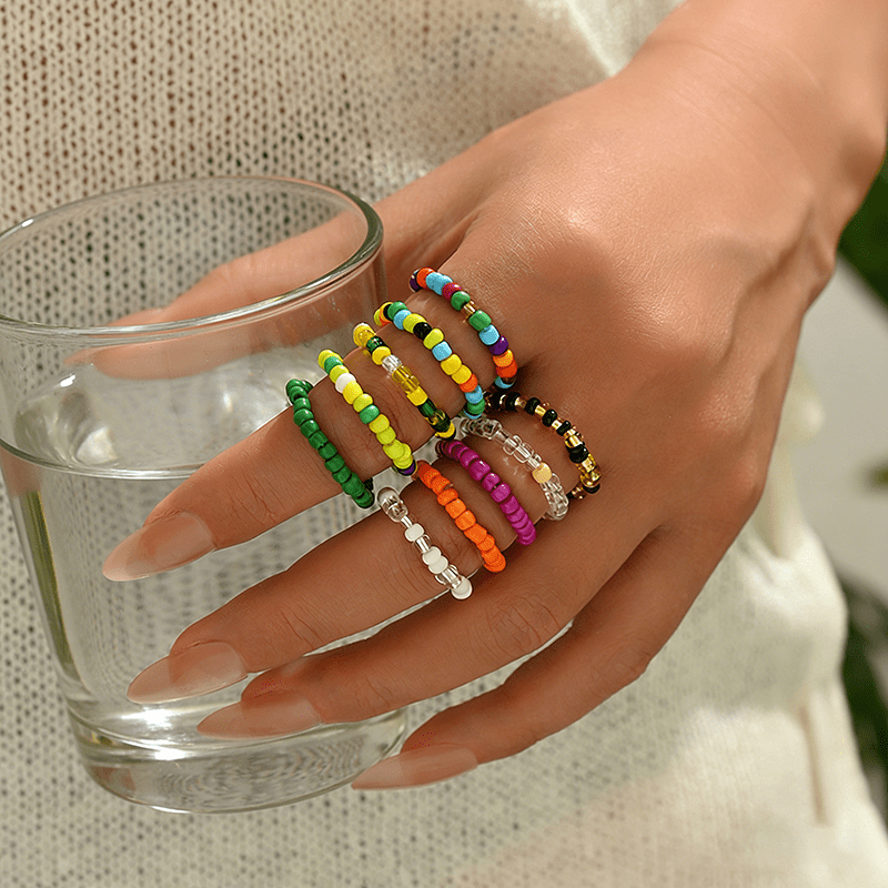 E-shop 10-teiliges Sommer-Strand-Meer Stil Mädchenhafter Stil buntes Perlenring-Set, böhmischer Stil kreative mehrschichtige stapelbare elastische