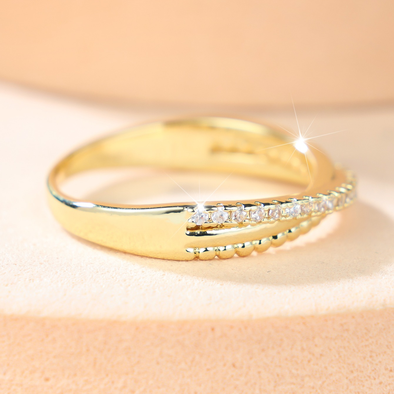 Elegant Golden Tone Pave Zirconia Ring, Twisted Design