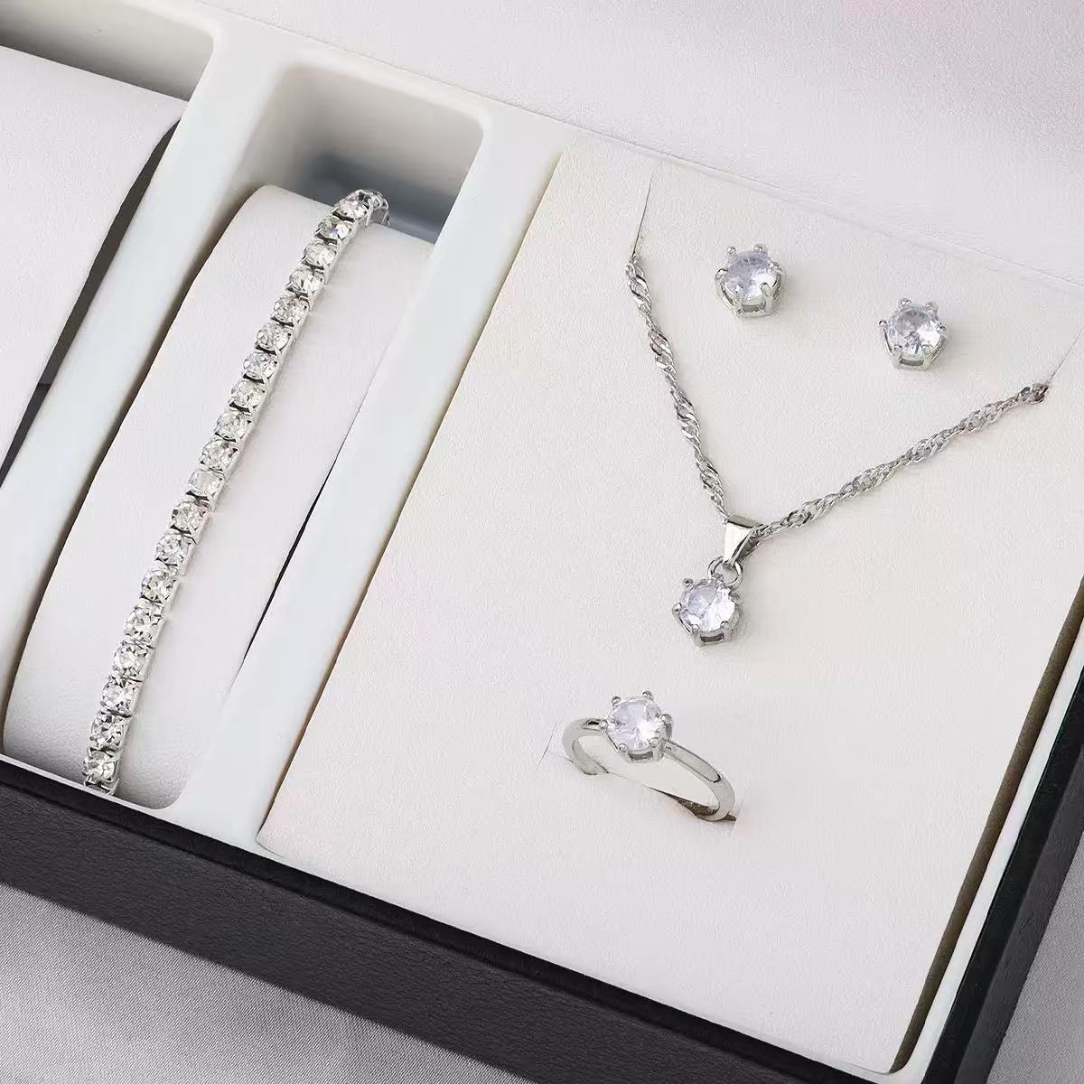 5pcs Fashionable and Luxurious Women's Jewelry Set, Including a Bracelet, Necklace, Earrings, and Ring, Packaged in a Shimmering Golden-themed Box.