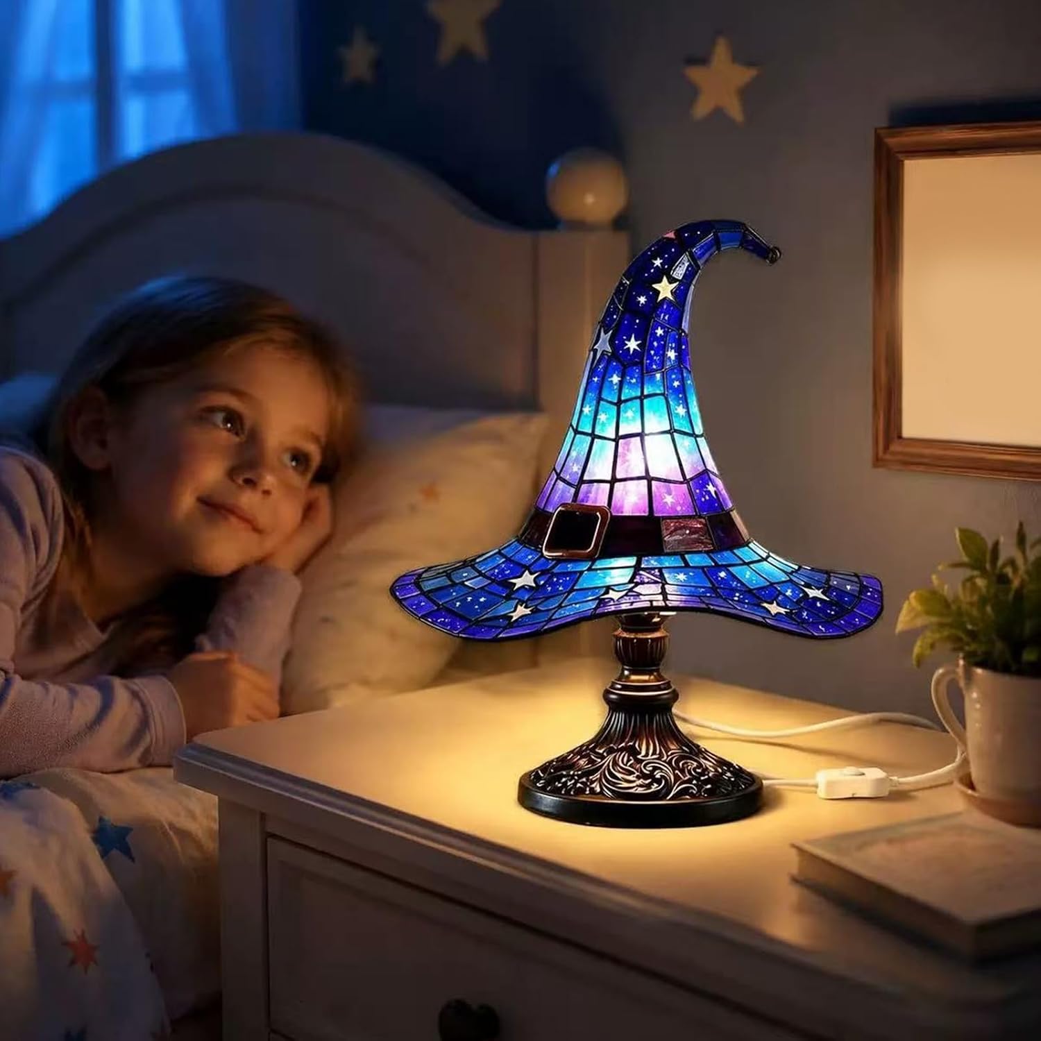 Blue and purple illuminated witch-hat-shaped lamp on a table