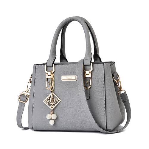 large capacity shoulder bag messenger bag trendy handbag with pendant multiple compartments zipper closure adjustable shoulder strap elegant and stylish design suitable for daily use and travel