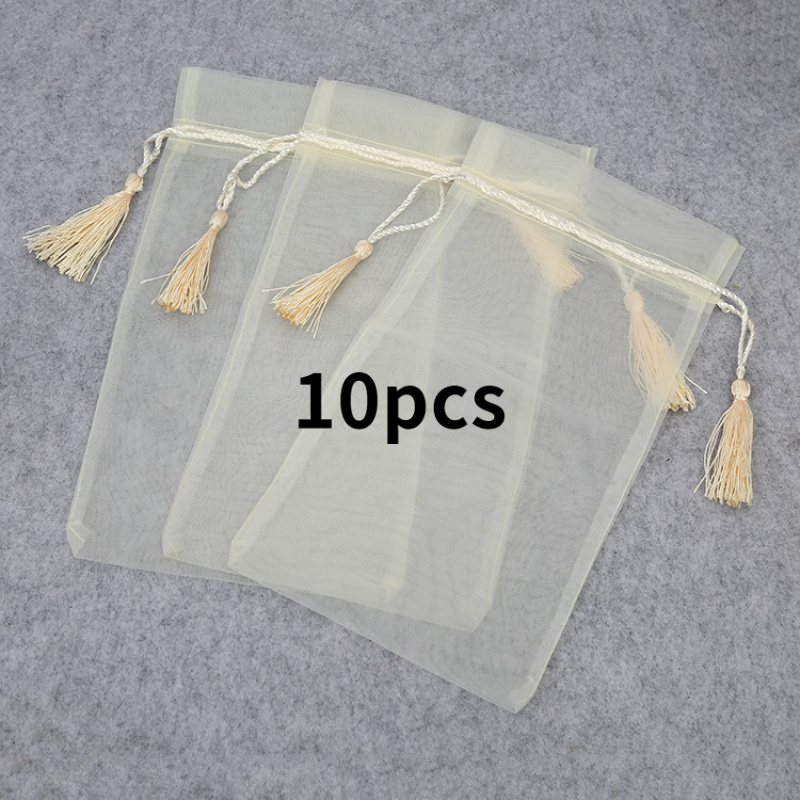 TEMU Cadeau pour elle/lui : un ensemble de 10 sacs à pompon très en organza. Ces nano-pochettes à cordon anti-accrochage parfaites pour de cadeaux,