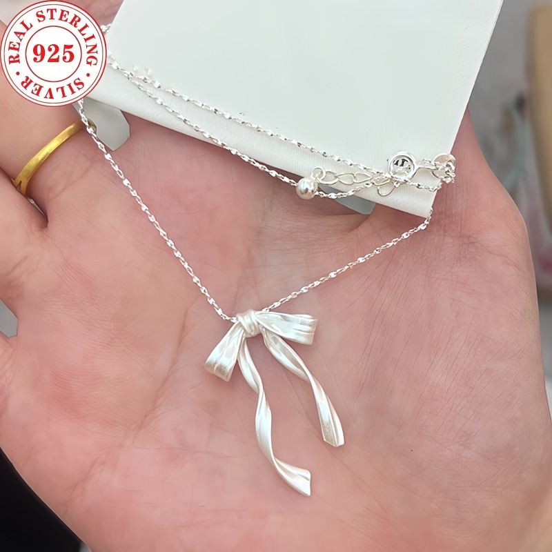 

Exquisite Handmade S925 Sterling Silvery Brushed Ribbon Bow Necklace With Free And Flexible Design Cool And Cute, Luxury Christmas Gift Small Crowd Collar Necklace Chain