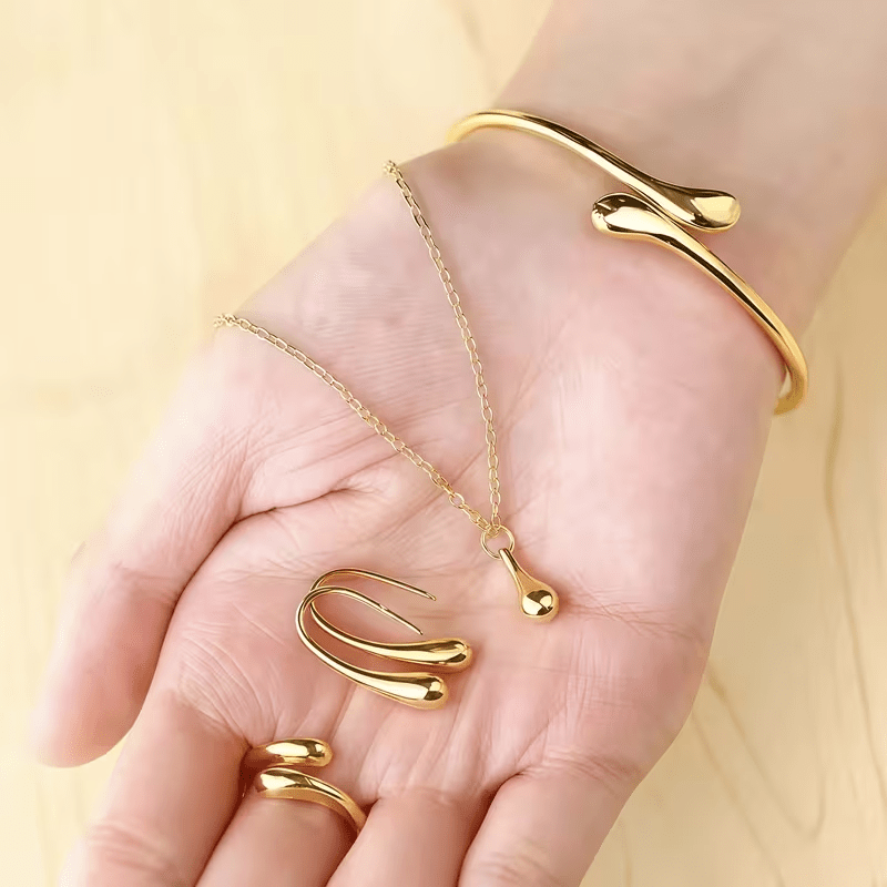 TEMU Stainless Steel 5pcs Set: A Stylish Women's Bracelet Jewelry Set In Golden, Featuring A Teardrop Pendant Necklace, Earrings, Bracelet, And Ring.