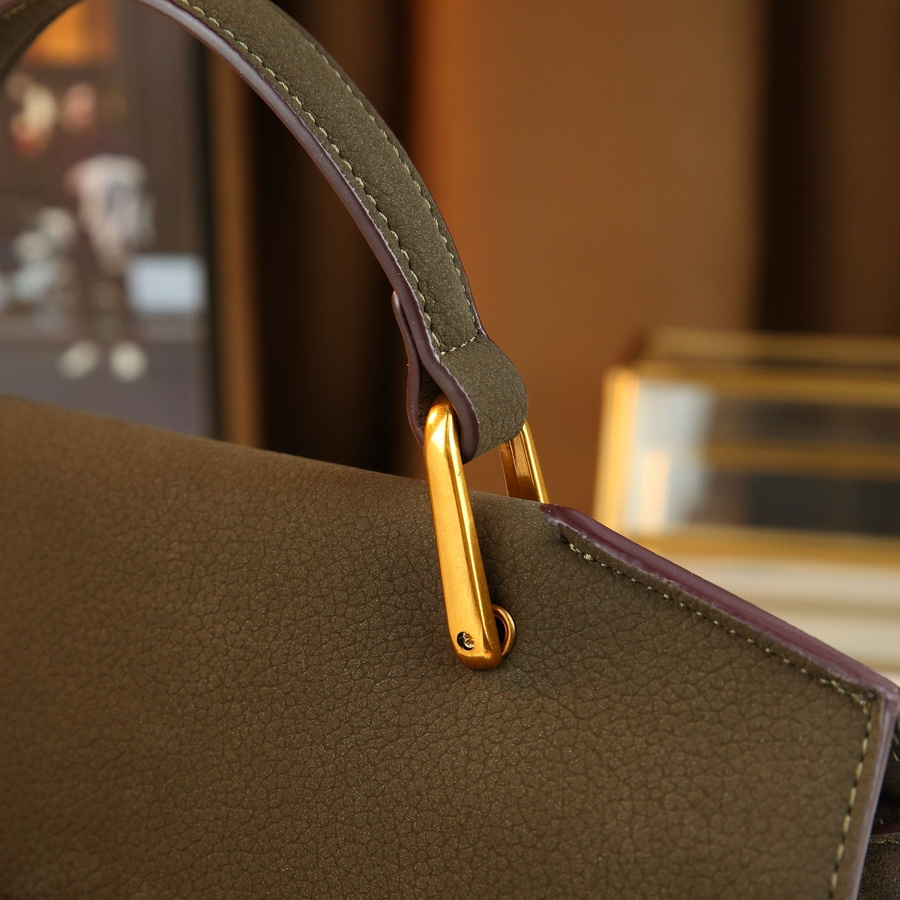 Handbag styled in a business setting