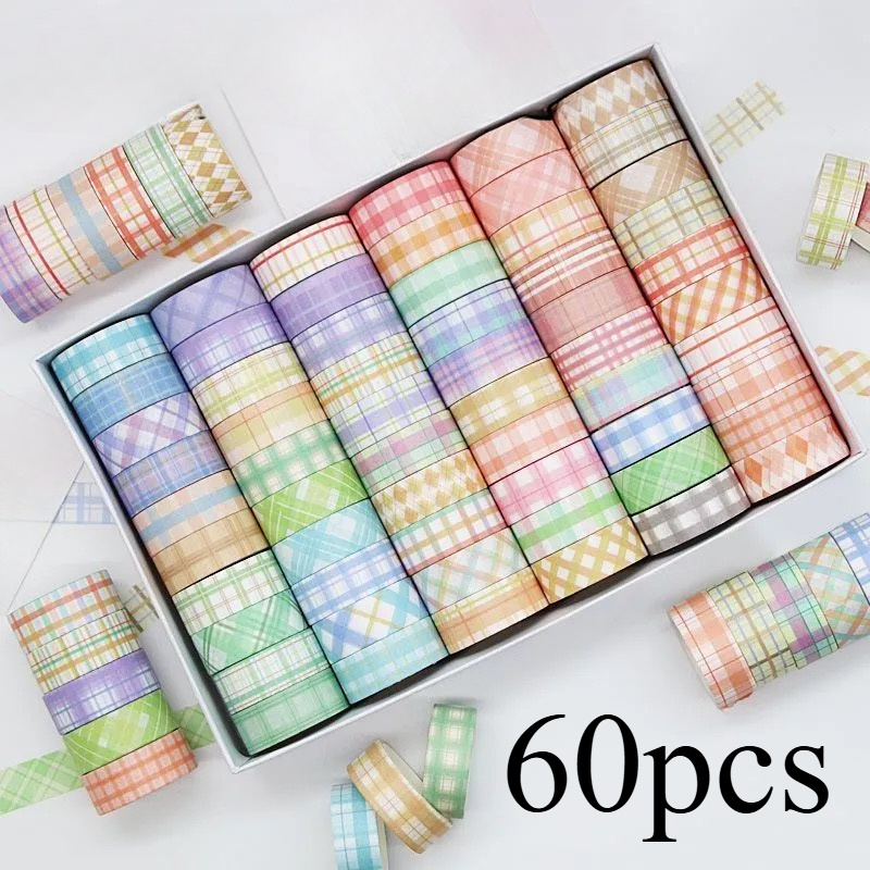 

Masking Tape Roll With A Wide Grid Design, Scrapbooking, Diy Crafts, And Artistic Projects, Made From Sturdy Paper.