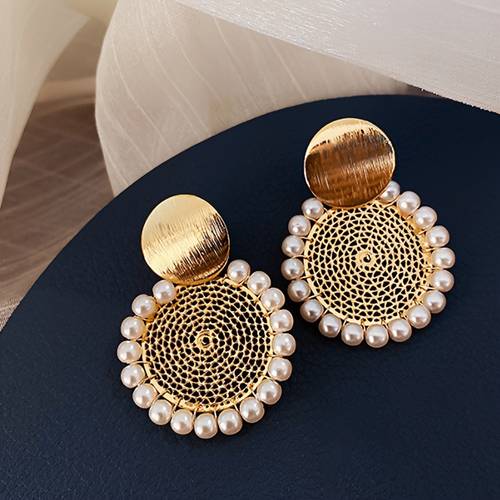 a pair of middle eastern ethnic style pattern engraved round mesh earrings