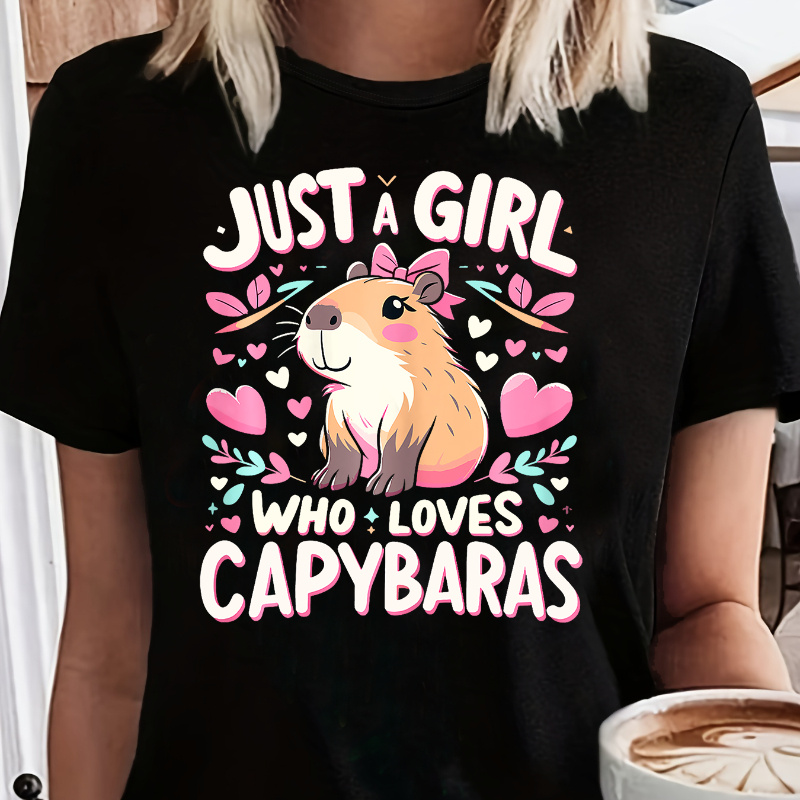 

une Fille qui Aime les Capybaras" T-Shirt Noir pour Femme - Mélange de Polyester et Confortable, Col Rond, Manches Courtes, Haut d'Été Décontracté avec Imprimé Capybara Coloré, T-Shirt Capybara