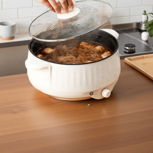 electric hot pot electric frying pan electric cooking pot all in one pot large capacity non stick base easy to clean multi functional for frying boiling and steaming three adjustable heat levels mini size suitable for stir frying rice fried eggs kitchen use
