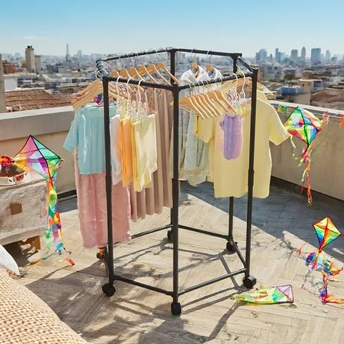 hexagonal rotating clothes hanger with wheels featuring a sturdy metal tube frame and independent hanging design portable and flexible in black and white organizes laundry room storage suitable for multiple ideal