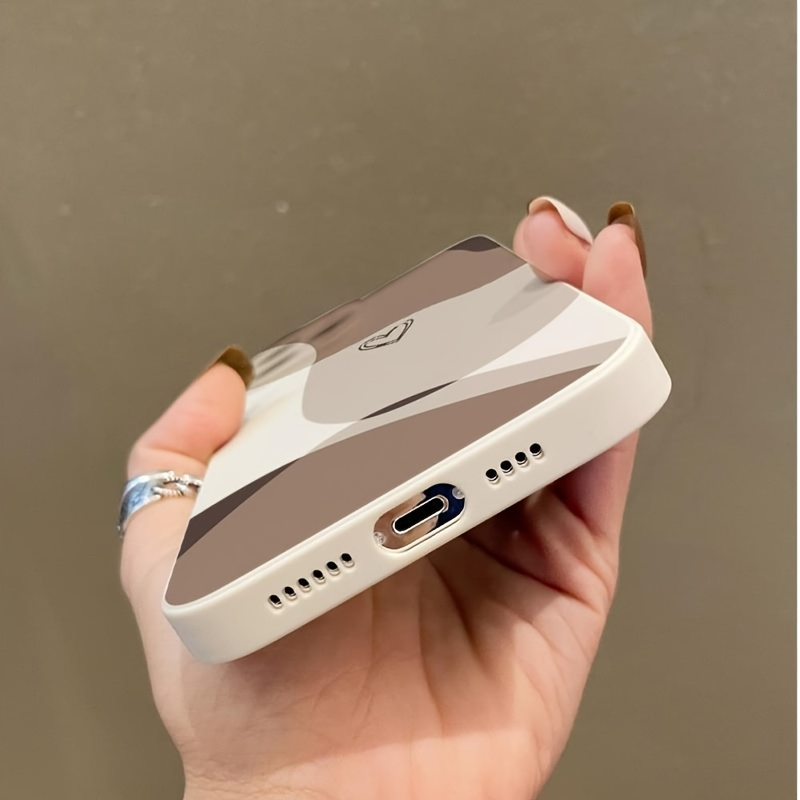 Light brown beige phone case, simple design with soft heart-shaped decoration, compatible with iPhone models 16, 15, 14, 13, 12, 11 Pro Max, XS, and XR