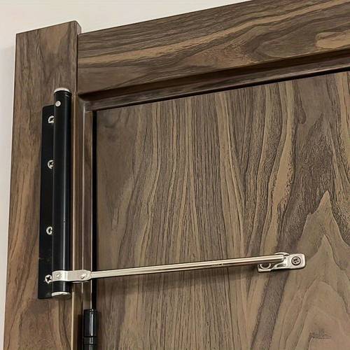 one piece of stainless steel automatic door closer featuring opening and closing safety spring this lightweight self closing hinge of metal suitable for homes hotels and offices a durable automatic door opener