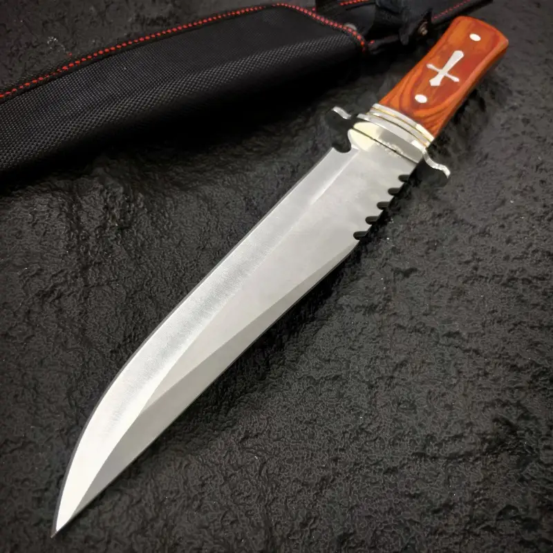 inch outdoor straight knife with a 7 4 inch blade length serrated design wooden handle with metal decoration with a black knife sheath a practical tool for the outdoors and a mens knife Product details 6