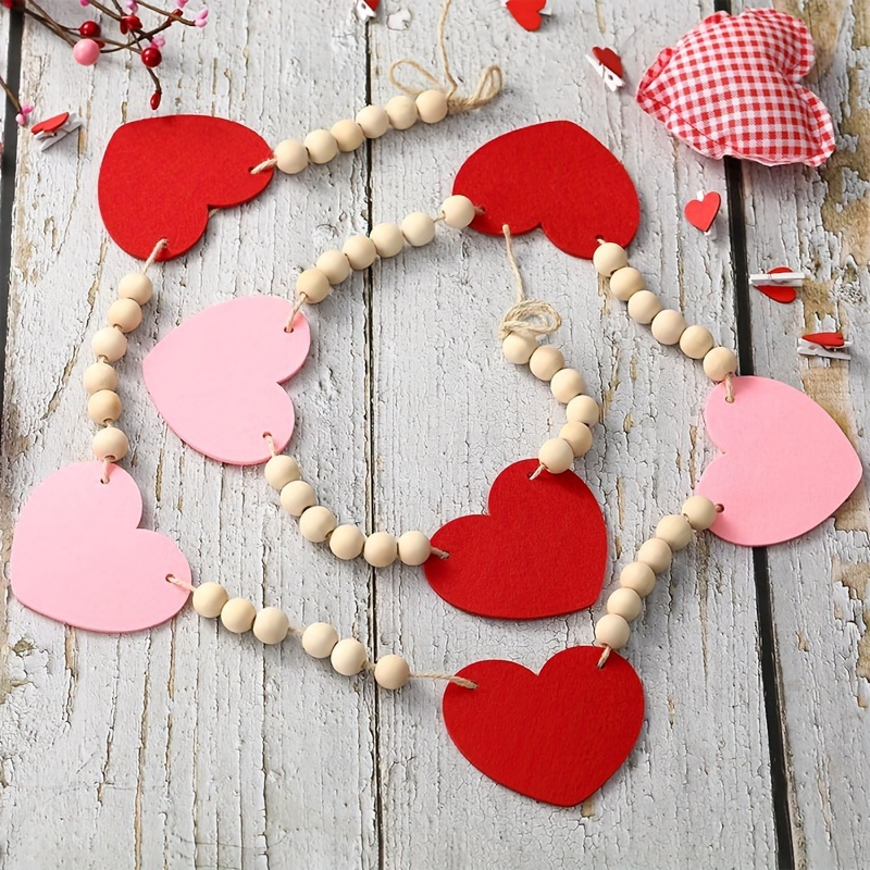 

Decorative Items For Day - A Garland Pink Felt Hearts And Wooden Beads, Adorning Your Fireplace Wall.