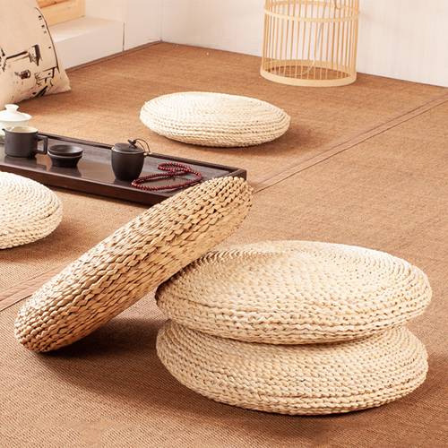a thickened rattan mat for zen meditation featuring a round pouf and a straw woven cushion designed for