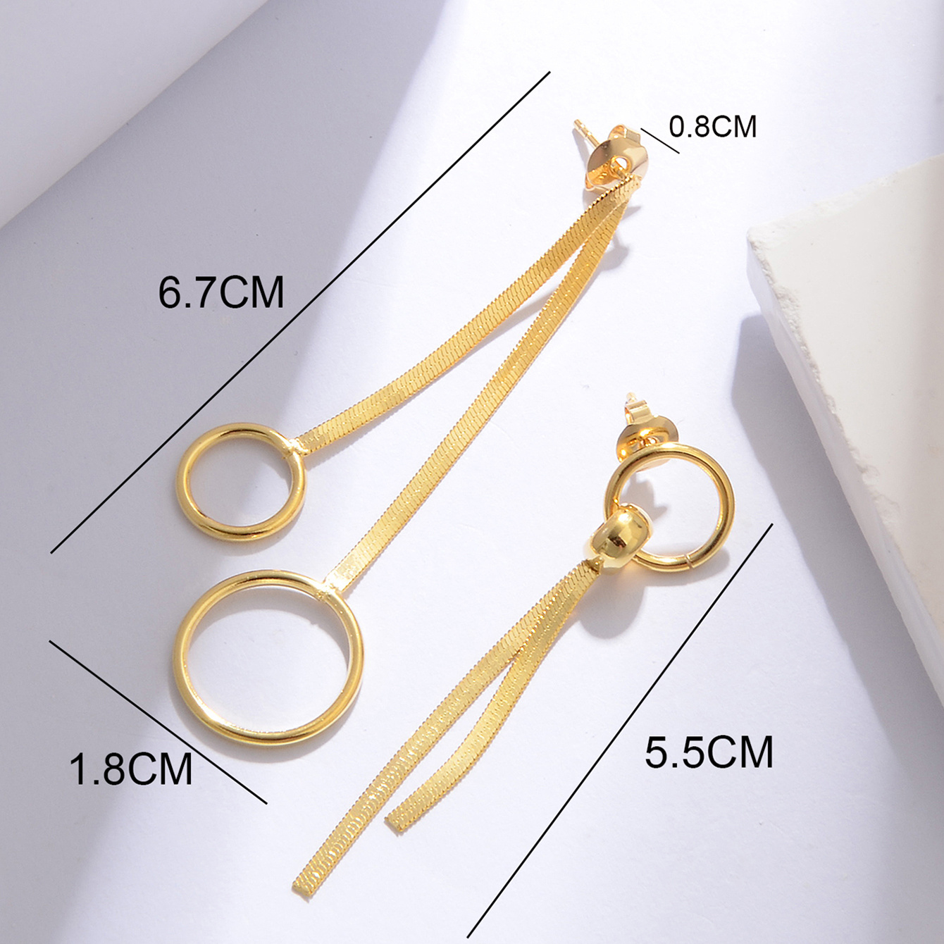 Women's Asymmetrical Circular Ring Snake Bone Chain Tassel Earrings