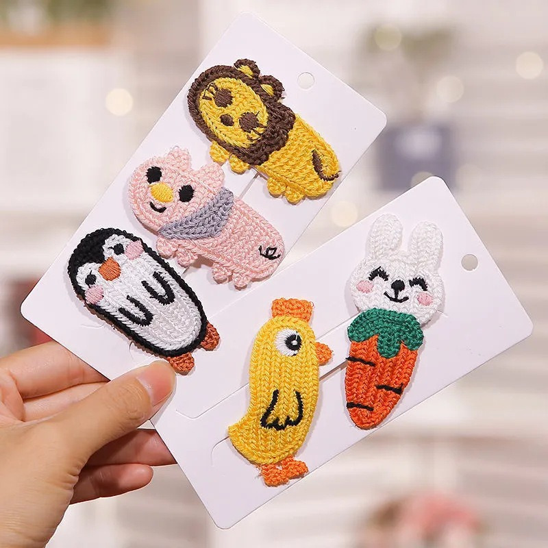 

A Set Of 10 Assorted Cartoon Hair Clips Featuring Cute And Animal Designs, Trendy Hairstyles And Sweet Knitted Accessories.