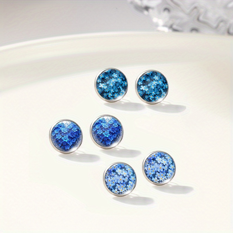 E-shop 3 Paar wunderschöne blaue Vergissmeinnicht-Blumenmuster runde Glas-Cabochon-Edelstahl-Steckerohrringe handgefertigter