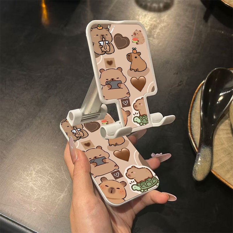 TEMU A Foldable Phone Stand Featuring A Design, This Portable And Adjustable Holder Is Ideal For Mobile Phones And Tablets. It Serves Multiple