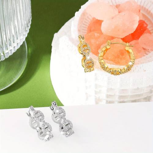a pair of womens fashion earrings punk hip hop style with white geometric shape copper inlay synthetic zirconia for daily wear and holiday gifting