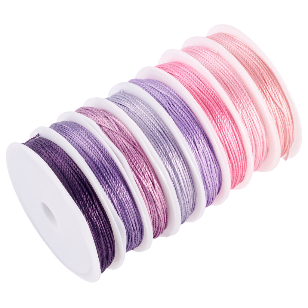 TEMU Rolls Of Twisted Polyester Cord In Different Colors, Each 15-ply And Round, With Spools Included. The Cord Is 0.9mm Thick And Approximately 10