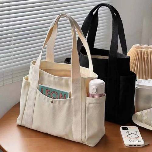 1pc fashionable canvas handbag womens single shoulder tote bag suitable for commuting school and daily use lightweight and large capacity storage popular zipper closure fixed shoulder straps