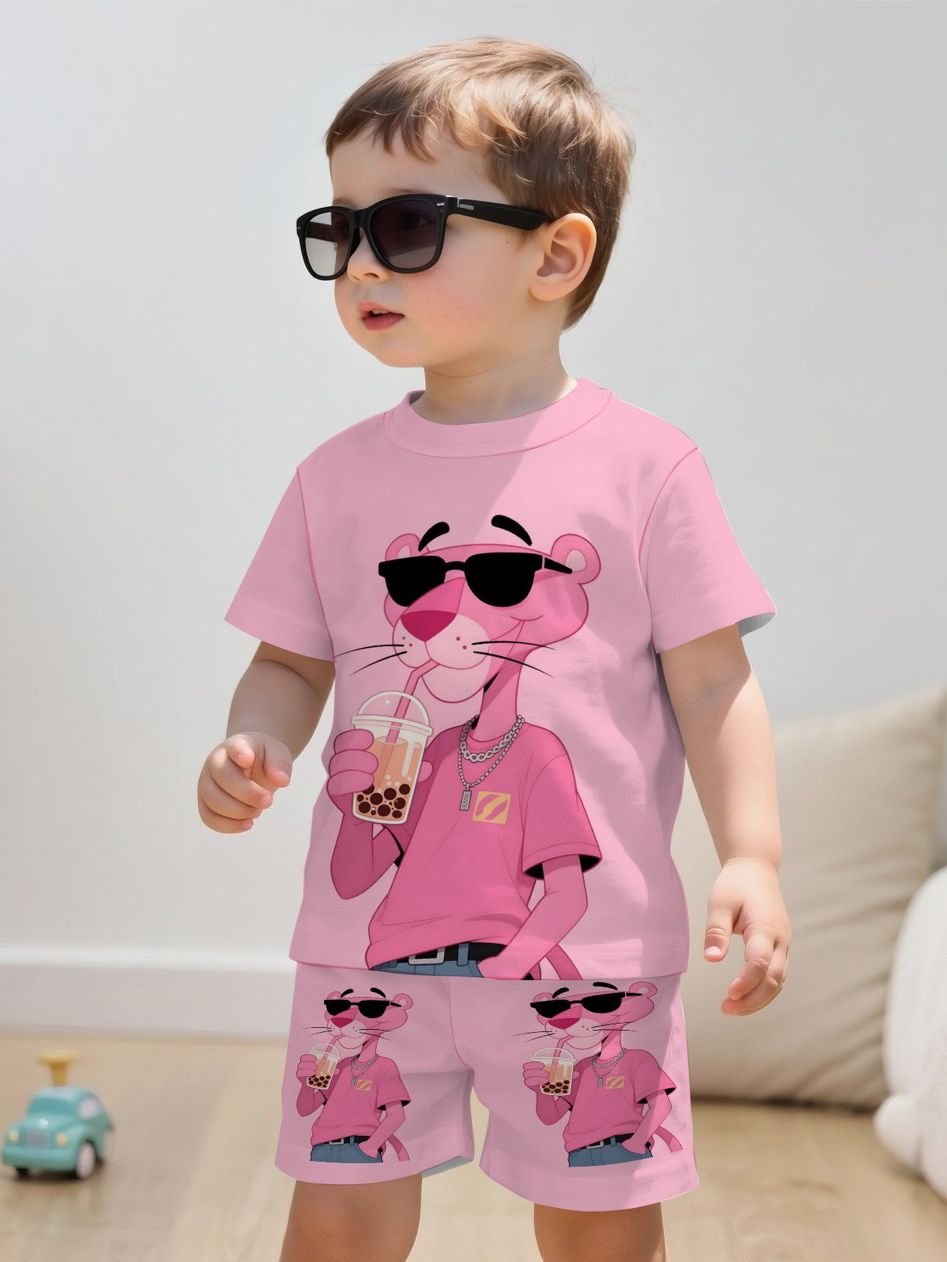 printed design featuring a cool boy wearing glasses and drinking milk tea short sleeve crewneck shirt and sports shorts set suitable as childrens clothing gift   comfortable fabric ideal for summer casual and sports 2pcs set