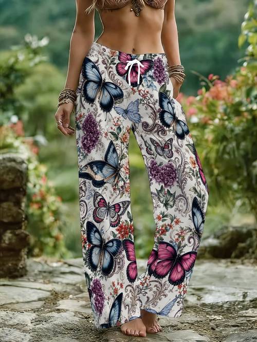 immagine dell'articolo pantaloni da donna taglia larga, base blu rosa e di fiori viola stampati , pantaloni larghi stile con elastico in vita