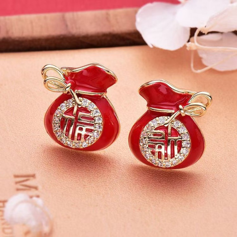 

Pair Of Bag Earrings With Characters, New Year Red Earrings