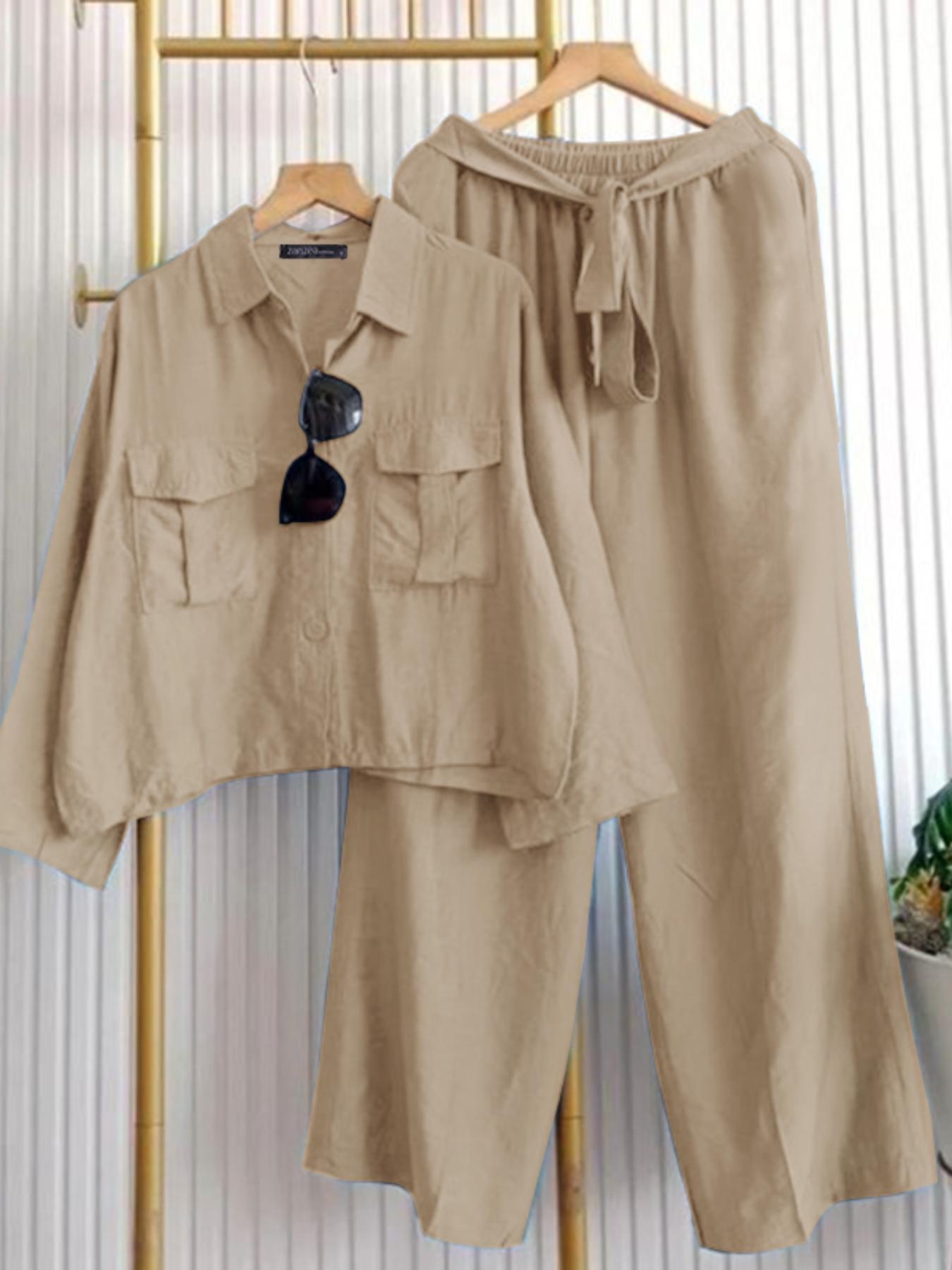 Effortlessly chic wide leg pants set in a springsummer ready color perfect for warm weather The set includes matching top and pants