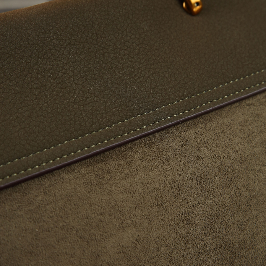 Model carrying bag with winter outfit