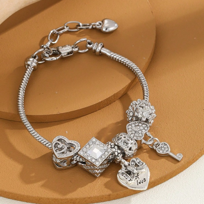 elegant stainless steel charm bracelet with heart key charms versatile for daily wear special occasions everyday accessory comfortable wear unisex jewelry for women 0