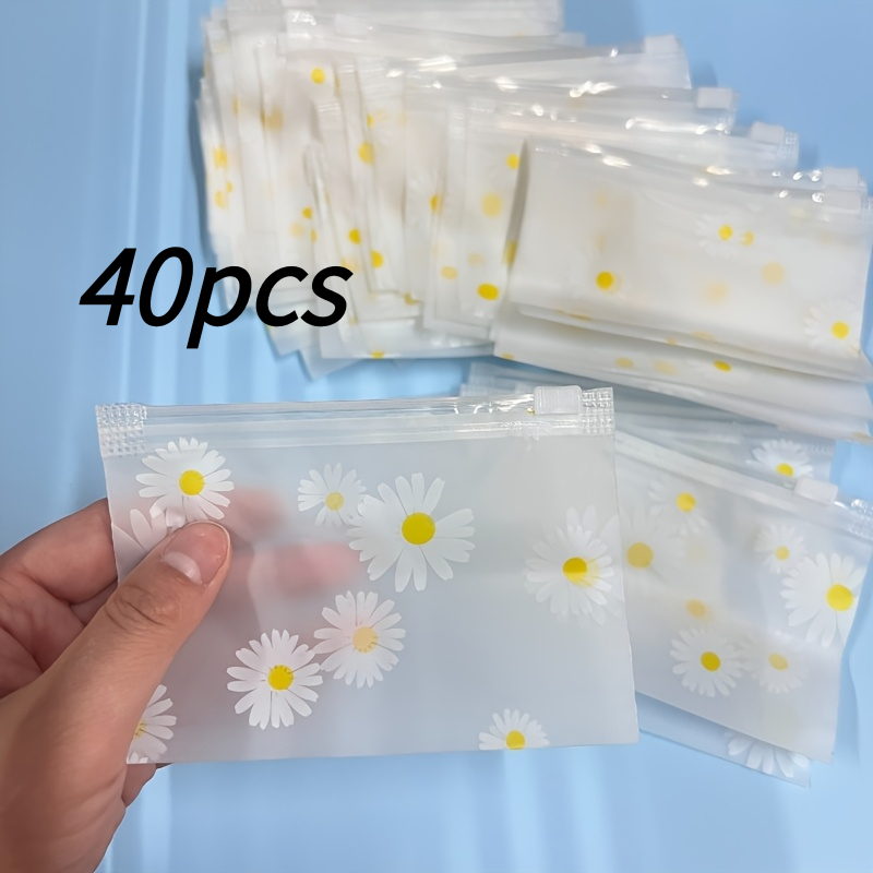 TEMU 40pcs Sacs à fermeture éclair en plastique avec imprimé marguerite, sacs transparents réutilisables auto-scellants, sacs de tri et de rangement