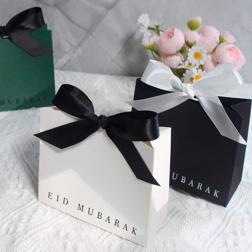 

Stylish Mini Gift Boxes For Eid – Elegant Design In Black, White, And Green With Classic Golden Lettering – Treats, Chocolates, And Small Gifts – Ideal For Eid Celebrations And Special Gifting