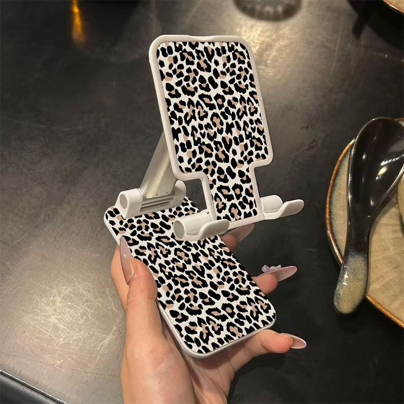 TEMU A Foldable Phone Stand Featuring A Leopard Print Design, This Portable And Adjustable Holder Is Ideal For Mobile Phones And Tablets. It Serves