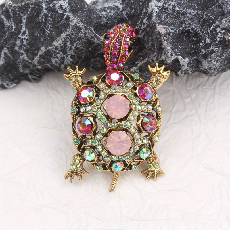 Image of Vintage-inspired Adorable Brooch Perfect For Garden Parties, Quirky Events, And Nostalgic -ups. Gingham Dresses, Cardigans, And Leather Handbags. Features A Turtle Design With Vibrant Rhinestones