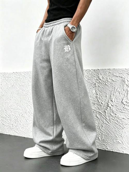 mens fleece casual sweatpants featuring style wide legs with a draping effect in black and light gray with side pockets suitable for home and outdoor wear