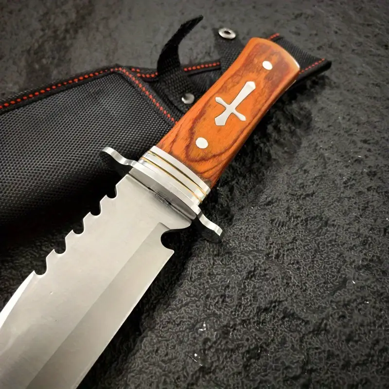 inch outdoor straight knife with a 7 4 inch blade length serrated design wooden handle with metal decoration with a black knife sheath a practical tool for the outdoors and a mens knife Product details 7