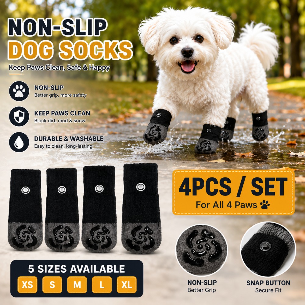 Four black non-slip dog socks with snap-button details and textured grip areas