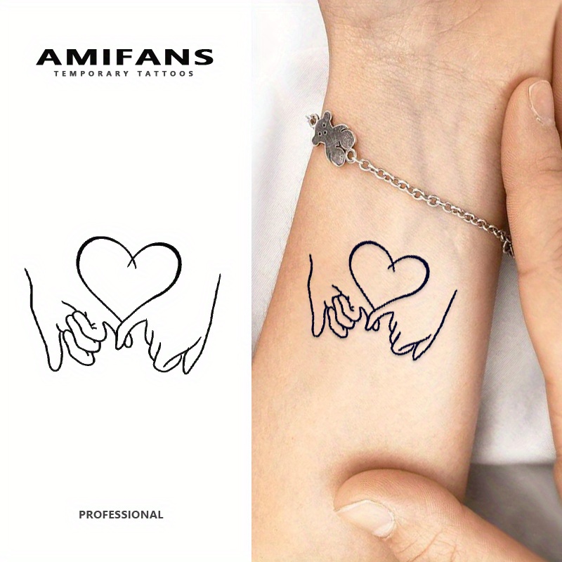 Of Semi-permanent Tattoos Featuring A Hand-in-hand Design, Measuring 1.9 Inches By 2.6 Inches. Temporary Tattoos Last For 1 To 2 Weeks And Are Designed For Adults