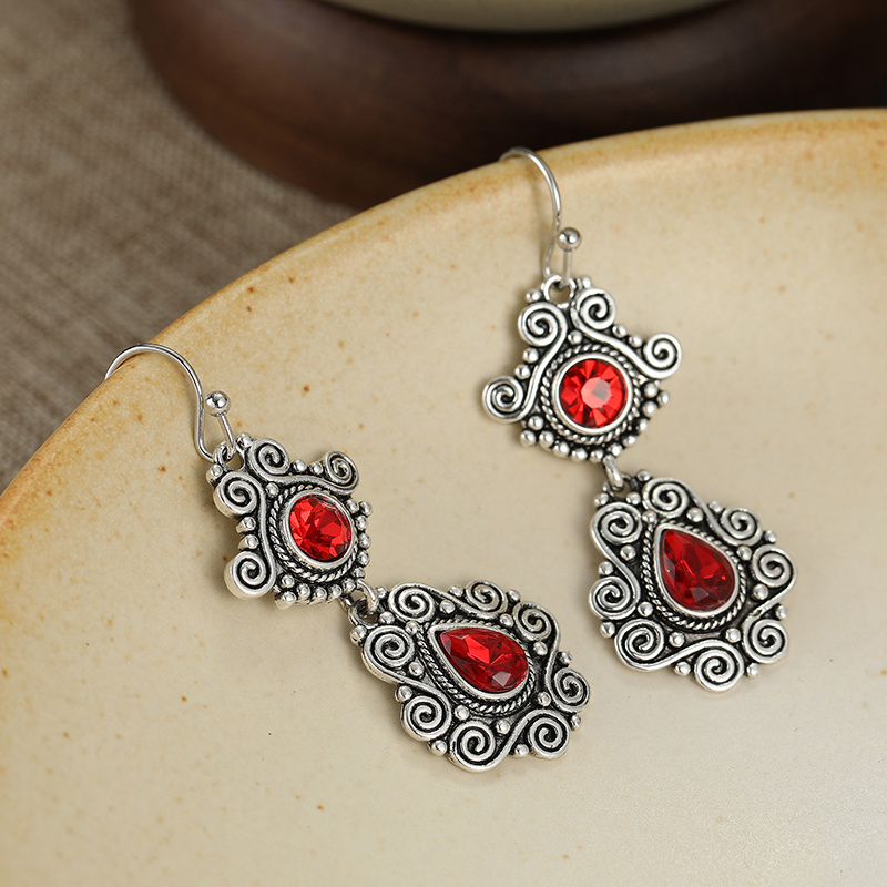 Engraved Spiral-Shaped Pendant Earrings with Red Artificial Crystals