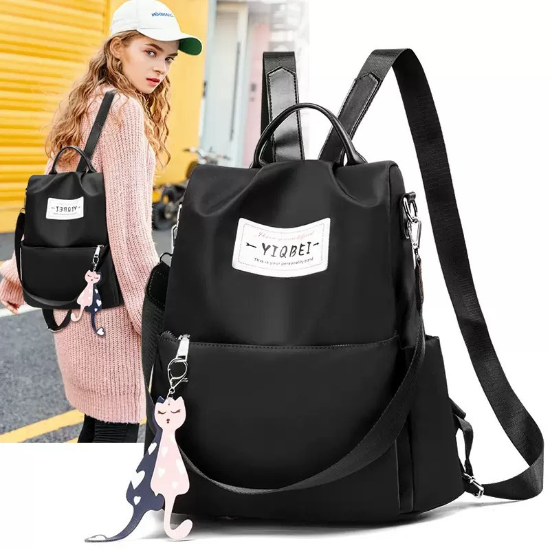 Mochila antirrobo para mujer, con dije, cierre de cremallera y correa ajustable, gran capacidad, ligera, material de nylon, ideal para viajes, actividades al aire libre y uso diario