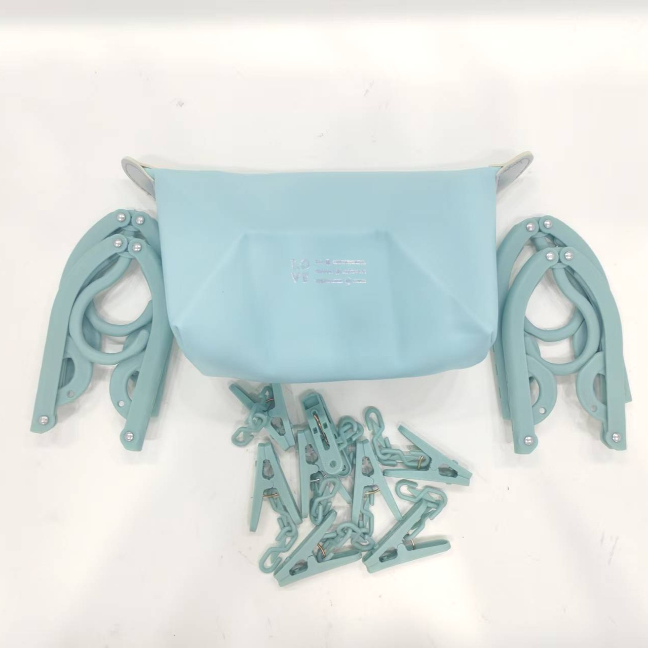 Image of 13pcs Portable Travel Hanger Set, Including 1pc Storage Bag - Featuring Smooth Plastic Surface And Space- Design, Including 4pcs Foldable Hangers And 8pcs Clips, Suitable For Travelers