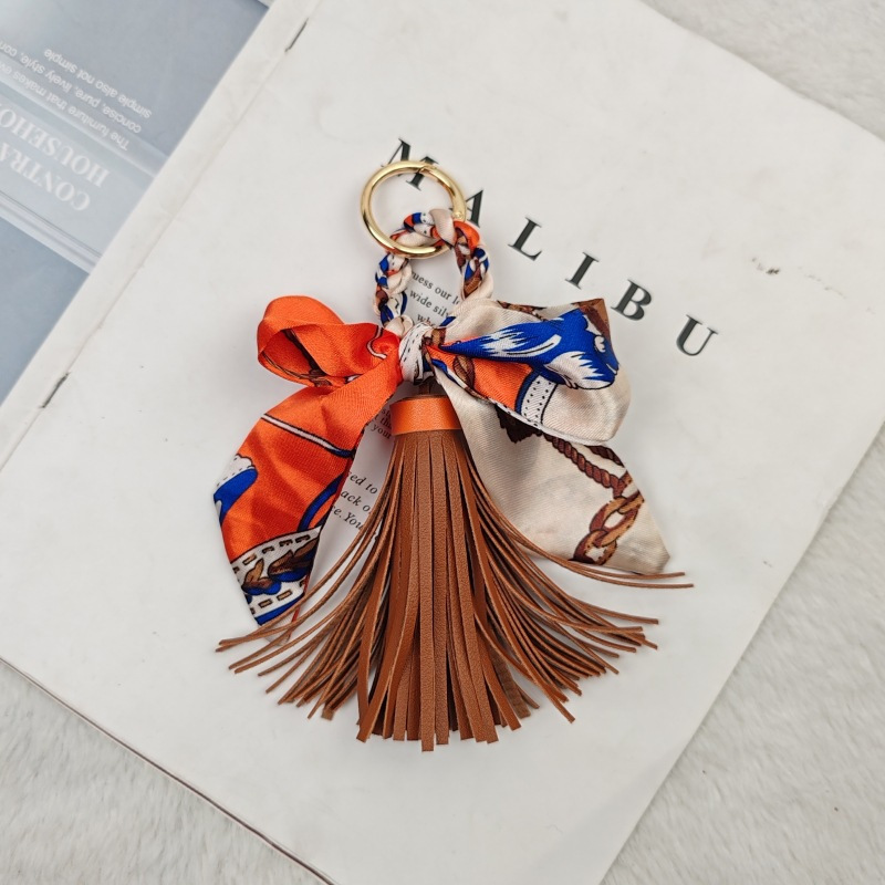 Image of [stylish Tassel Keychain] 17cm Stylish Pu Tassel Keychain| Plush Animal Design, Orange, Blue& Brown Scarf Bow And Pom Pom, Perfect For Phone Or Bag Accessories