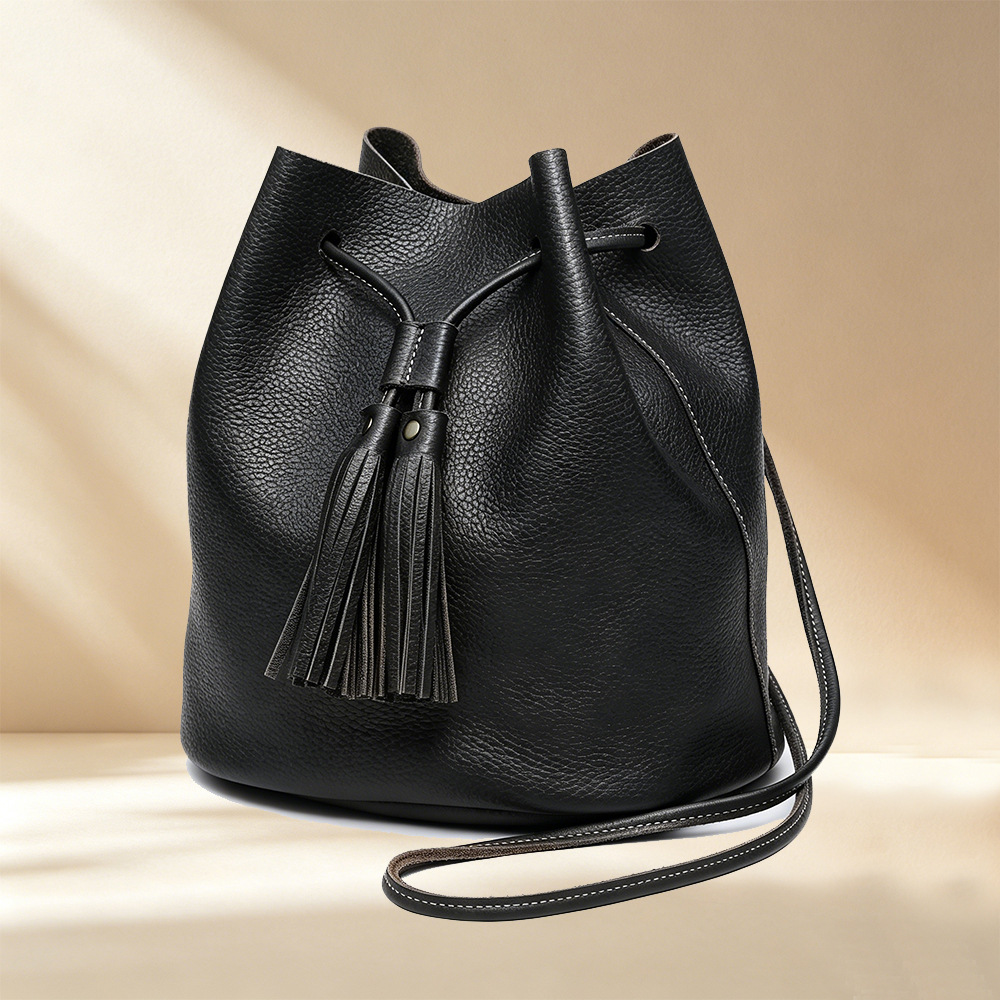 Image of 2026 Women's Bucket Bag Made Of Full-grain Cowhide Leather, Soft And Durable. Drawstring With Tassel And Rivets Adds A Korean-. , Shoulder